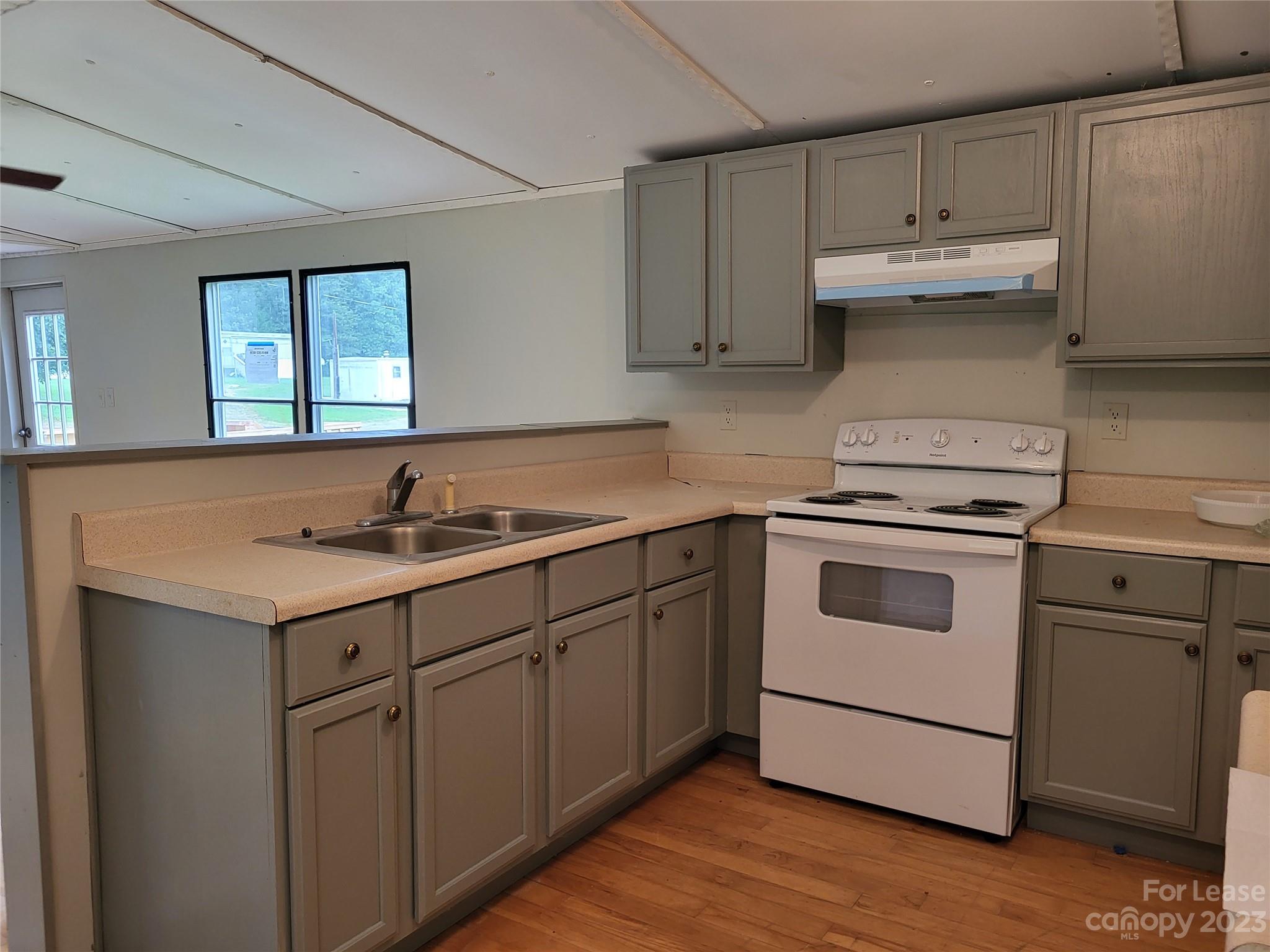 1158 Wagon Wheel Road, Unit 7 Hickory, NC 28602 - Photo 5 of 11 a kitchen with cabinets appliances and a sink