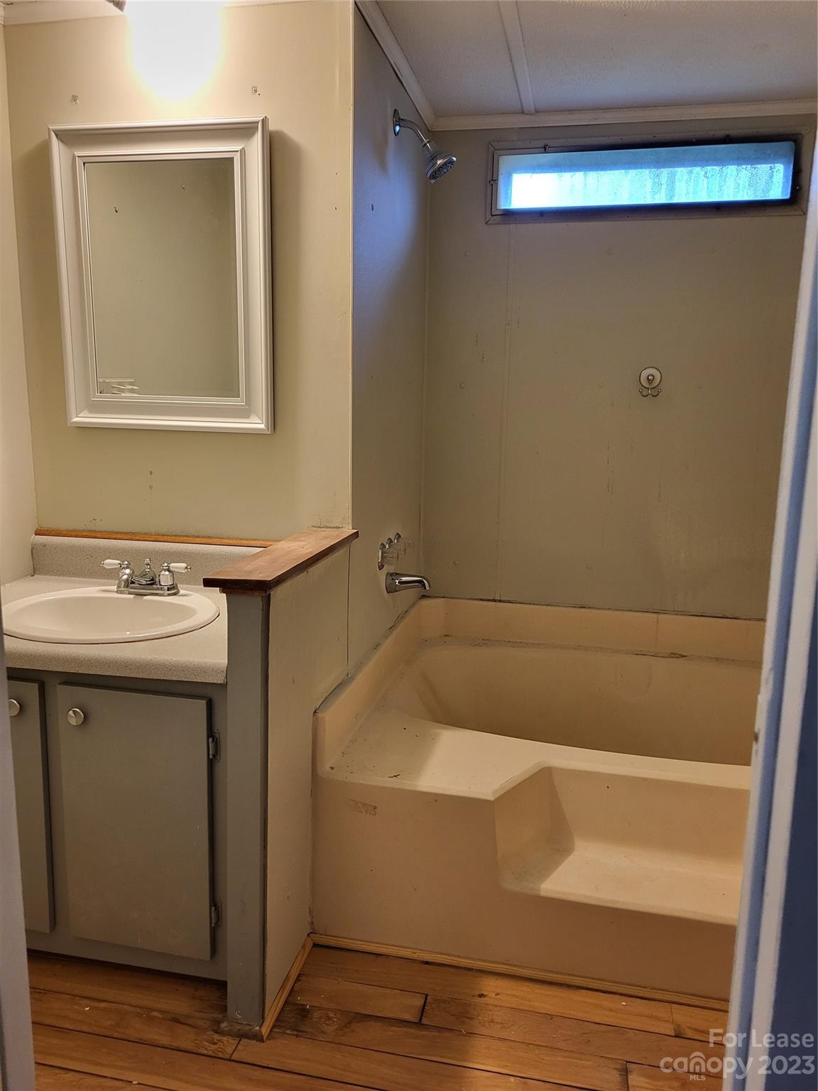 1158 Wagon Wheel Road, Unit 7 Hickory, NC 28602 - Photo 7 of 11 a bathroom with a sink and mirror