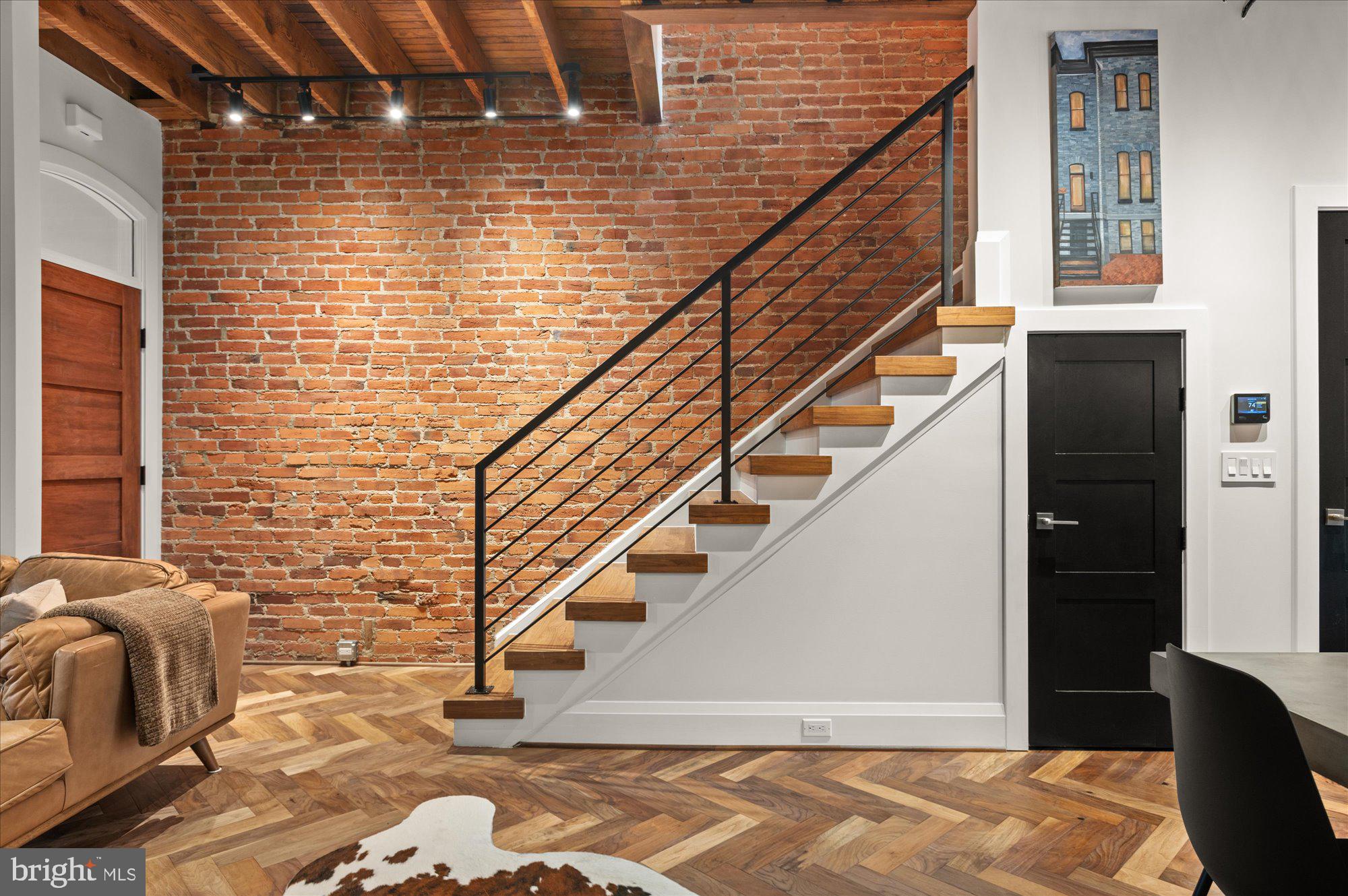 1416 Swann Street Northwest Washington, DC 20009 - Photo 21 of 52 Exposed brick & custom staircase