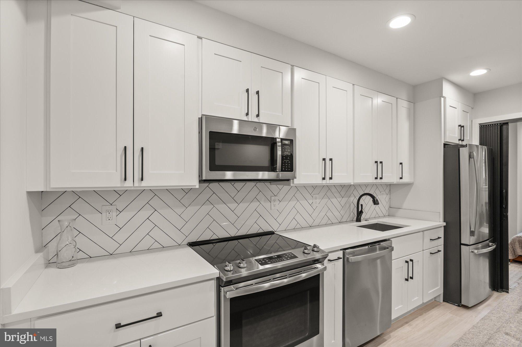 1416 Swann Street Northwest Washington, DC 20009 - Photo 41 of 52 Full kitchen with stainless steel appliances