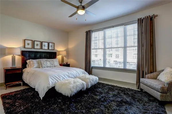 a bedroom with a bed and a couch