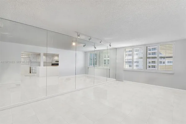 a living room with lots of furniture and a flat screen tv
