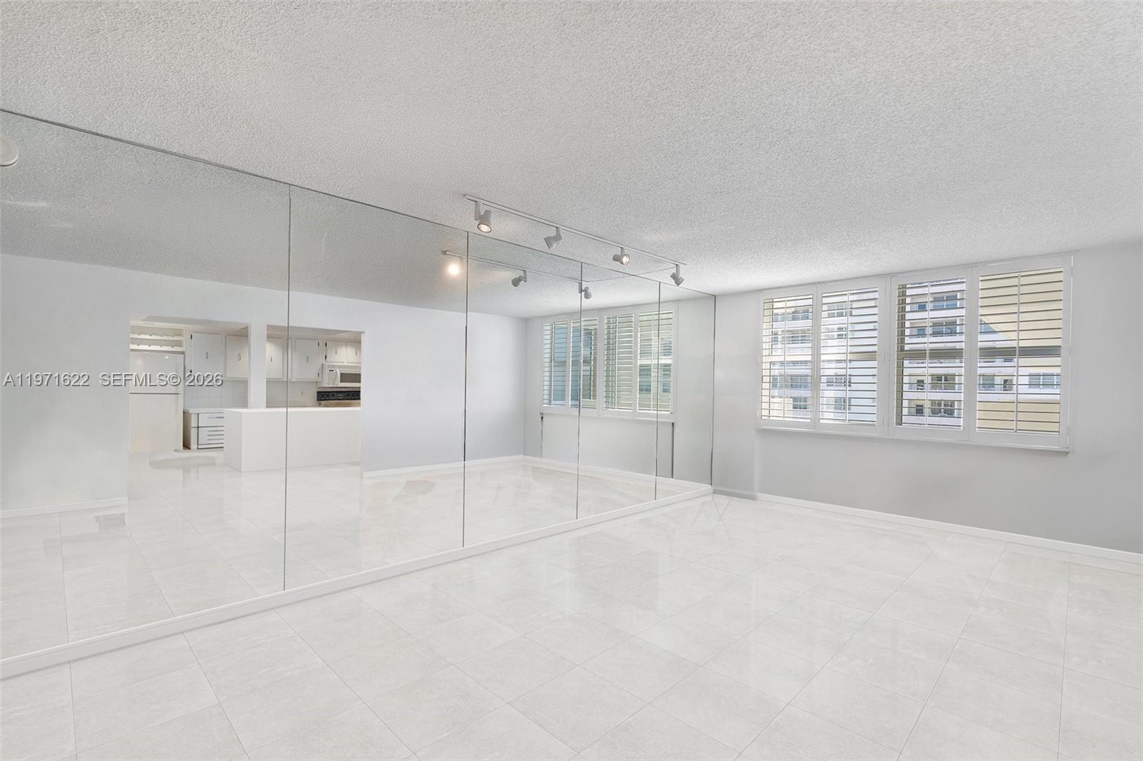 9273 Collins Avenue, Unit 901 Surfside, FL 33154 - Photo 8 of 24 a view of an empty room with a window