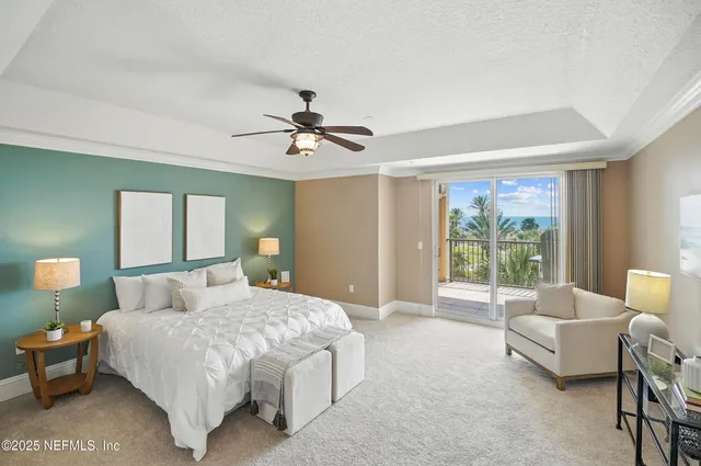 a bedroom with a balcony a bed and a couch