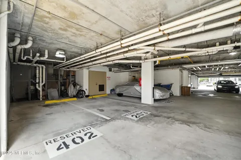 a view of parking garage with cars