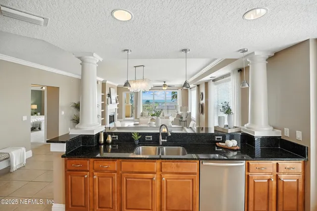 a kitchen with granite countertop a sink and a counter top space