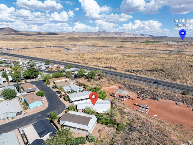 3941 West 40 North Hurricane, UT 84737 - Photo 55 of 55 Aerial view showcasing a residential area bordered by a highway and expansive desert landscape