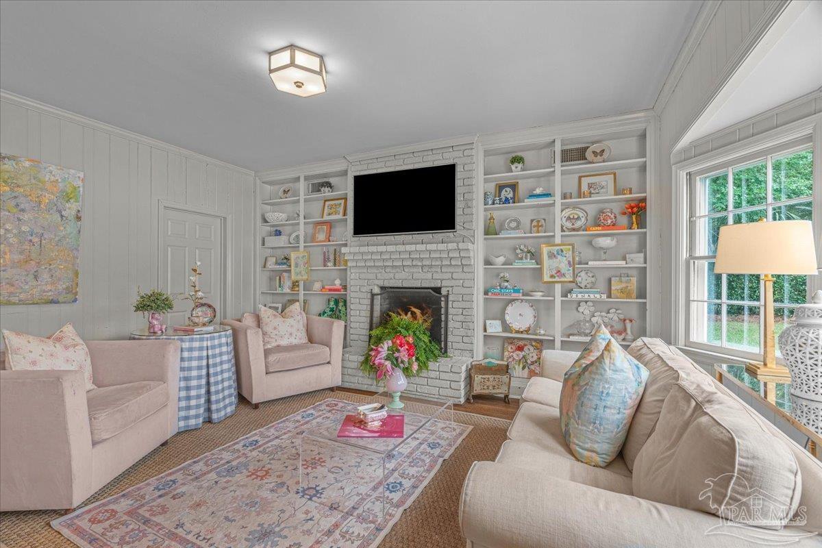 3361 Palermo Road Pensacola, FL 32503 - Photo 33 of 50 a living room with furniture fireplace and a flat screen tv