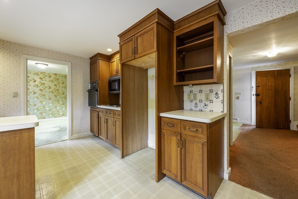 41 Squire Road Winchester, MA 01890 - Photo 11 of 25 a bathroom with a sink a mirror and a shower