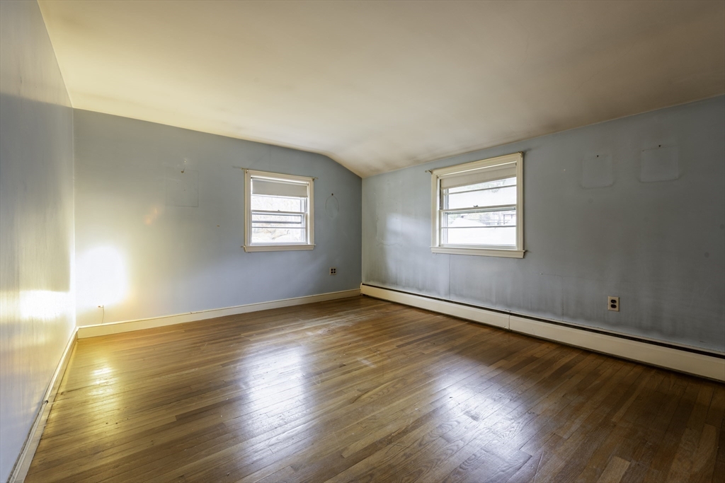 41 Squire Road Winchester, MA 01890 - Photo 14 of 25 an empty room with wooden floor and windows