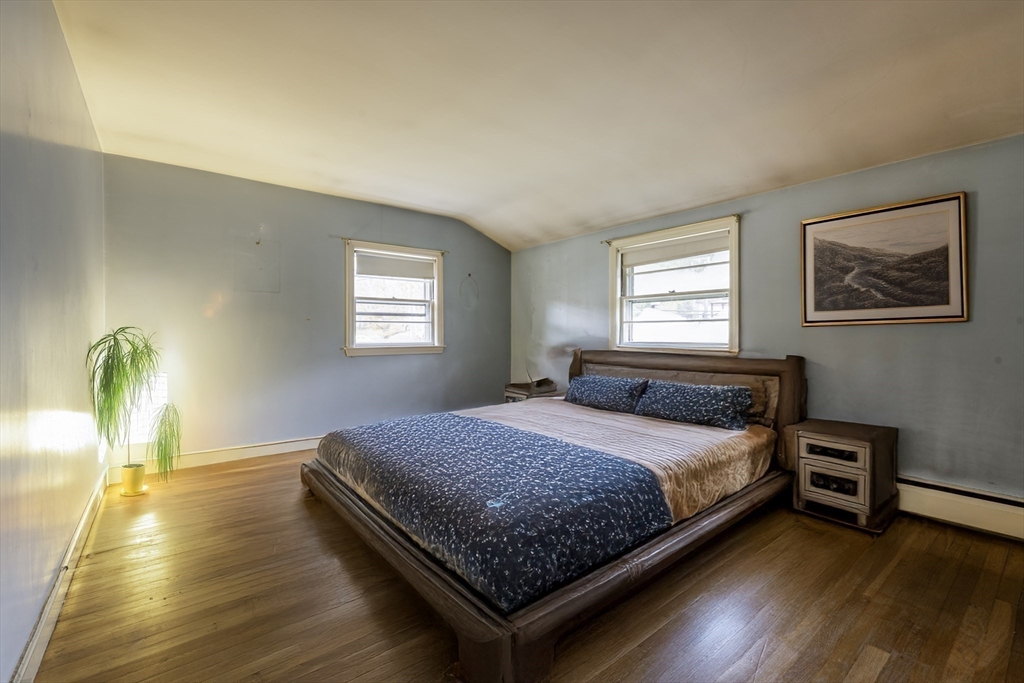41 Squire Road Winchester, MA 01890 - Photo 15 of 25 a bedroom with a bed and window