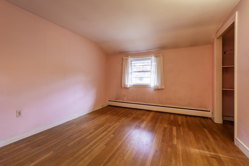 41 Squire Road Winchester, MA 01890 - Photo 16 of 25 an empty room with wooden floor and windows