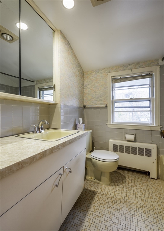 41 Squire Road Winchester, MA 01890 - Photo 17 of 25 a bathroom with a granite countertop sink and a toilet