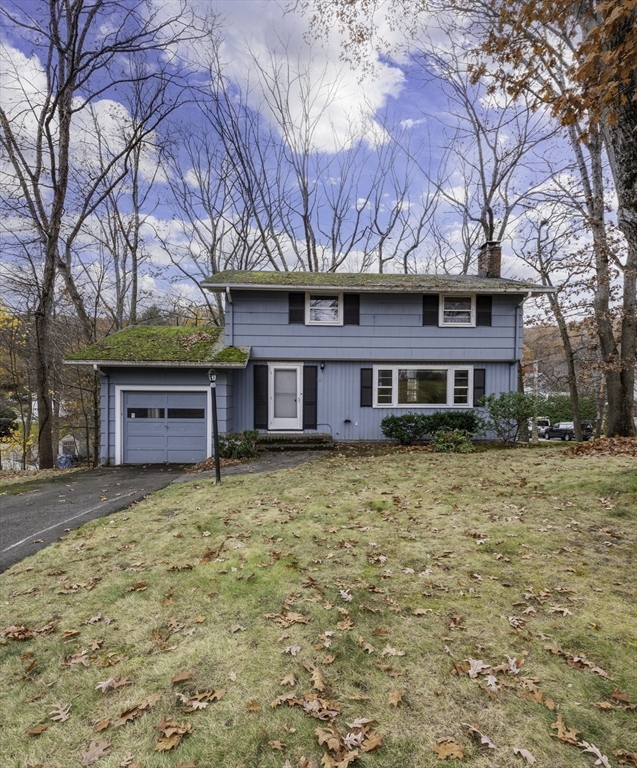 41 Squire Road Winchester, MA 01890 - Photo 2 of 25 a front view of a house with a yard