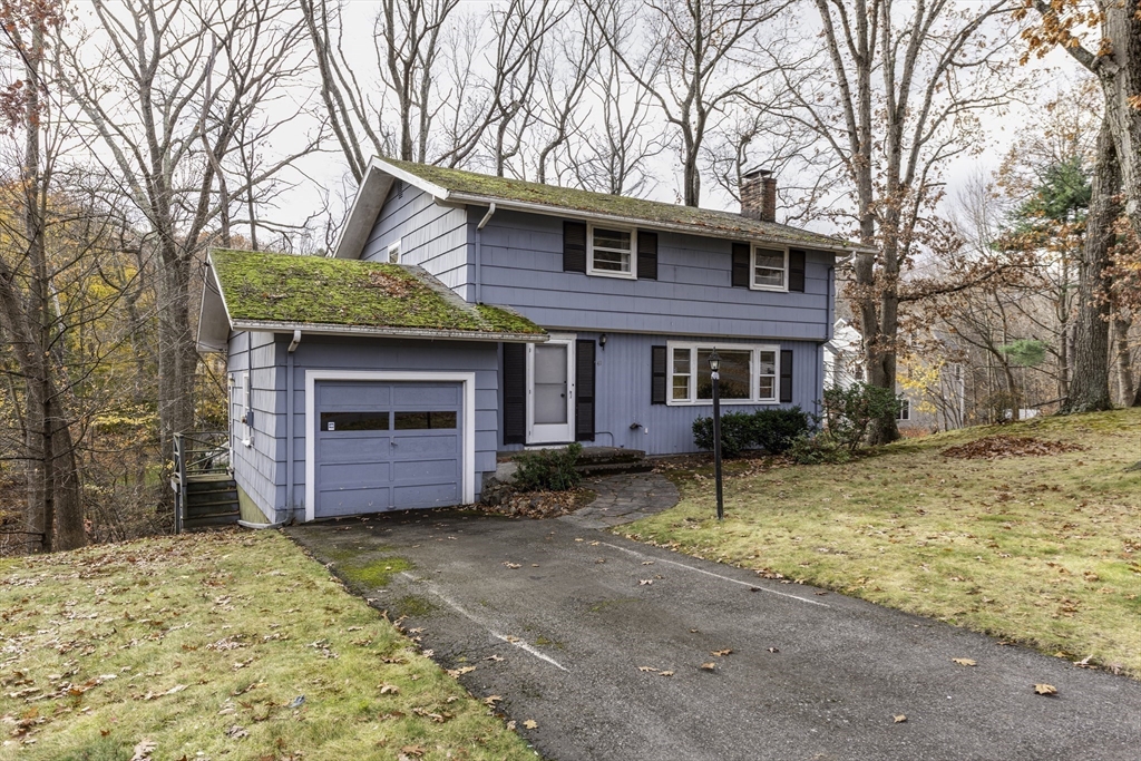 41 Squire Road Winchester, MA 01890 - Photo 25 of 25 a view of a house with a yard covered in snow