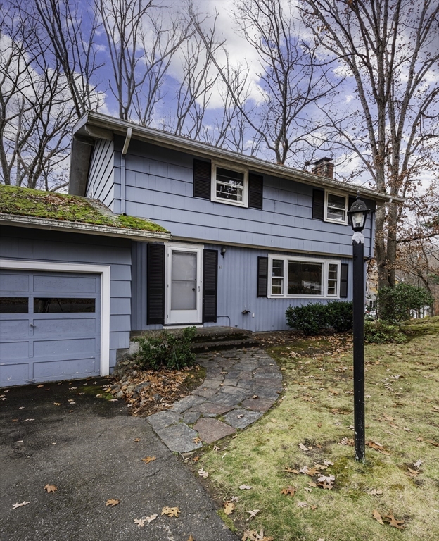 41 Squire Road Winchester, MA 01890 - Photo 4 of 25 a front view of a house with a yard