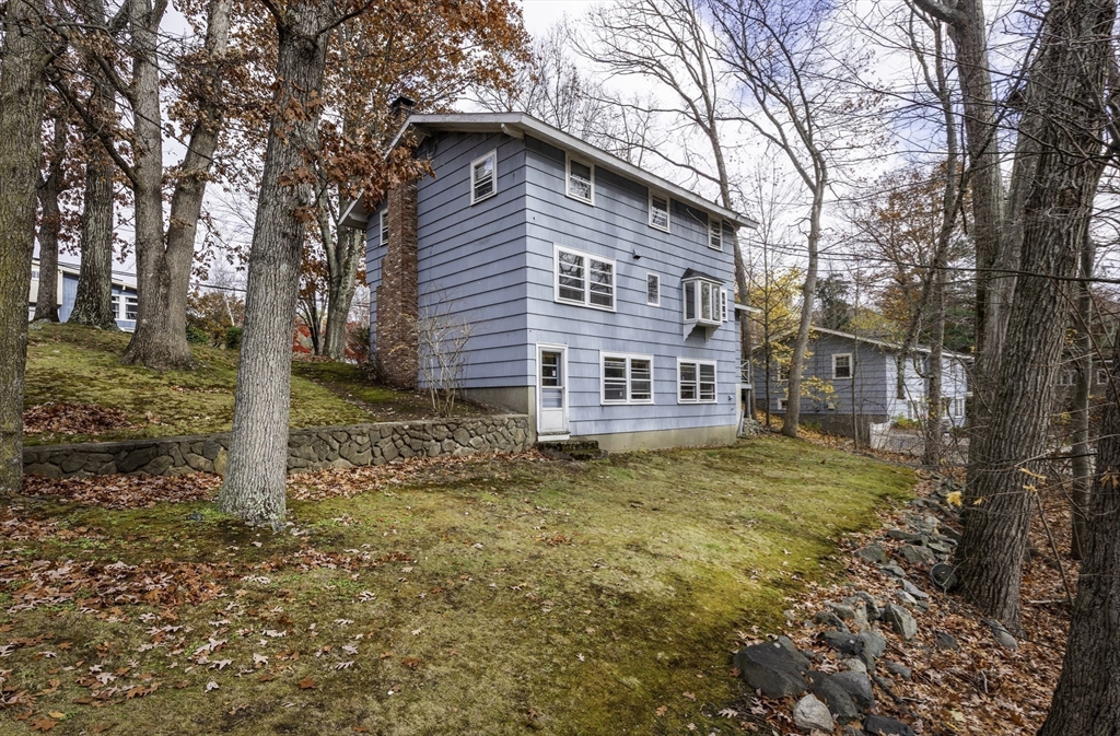 41 Squire Road Winchester, MA 01890 - Photo 5 of 25 a view of a house with a yard