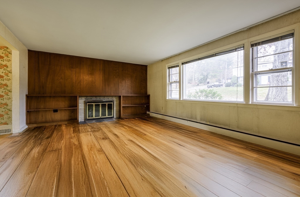 41 Squire Road Winchester, MA 01890 - Photo 8 of 25 a view of empty room with wooden floor and fan