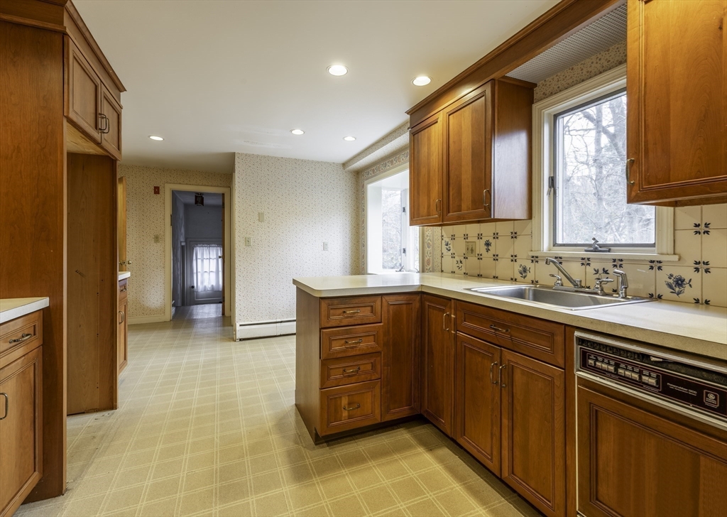 41 Squire Road Winchester, MA 01890 - Photo 10 of 25 a bathroom with a sink a vanity and a mirror