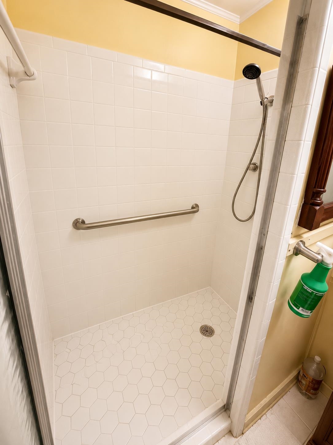 7280 Walsh Road Millington, TN 38053 - Photo 19 of 34 Walk-in shower featuring white subway tile walls, a hexagonal tile floor, and a brushed nickel grab bar