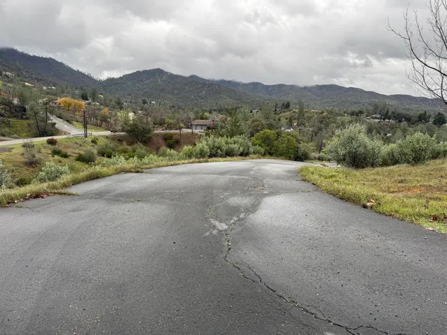 a view of a road with houses