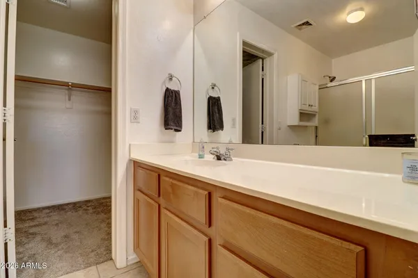 a bathroom with a double vanity sink and mirror