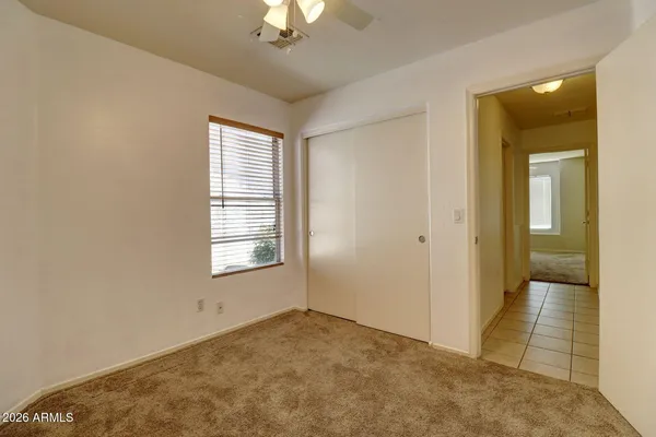 a view of an empty room with a window