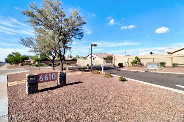 a view of multiple houses with a road