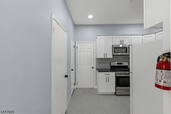a bathroom with a shower and a sink
