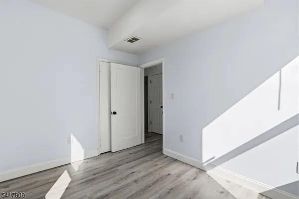 a view of livingroom with furniture and wooden floor