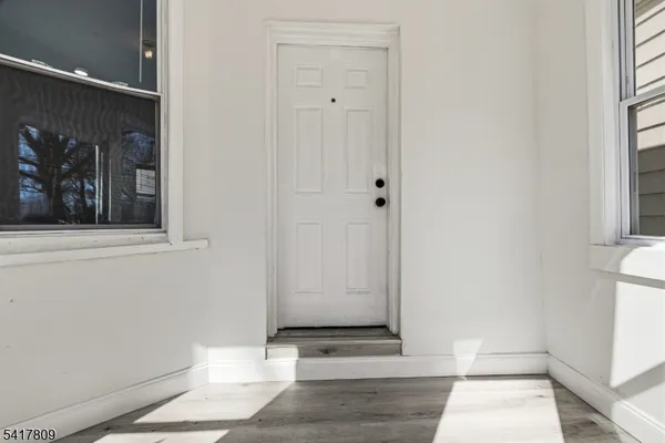 a kitchen with a refrigerator and a sink