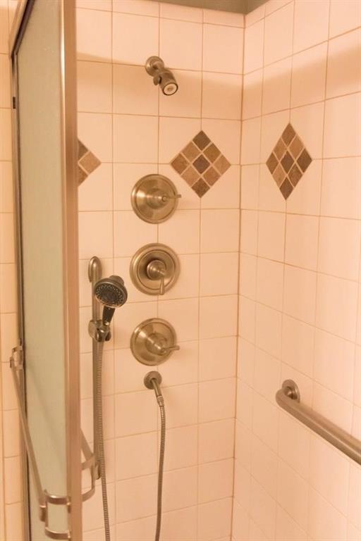 557 Grace Coppell, TX 75019 - Photo 16 of 22 a bathroom with a shower