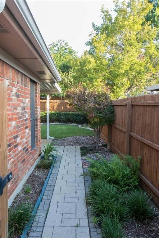 557 Grace Coppell, TX 75019 - Photo 3 of 22 a view of a backyard with plants