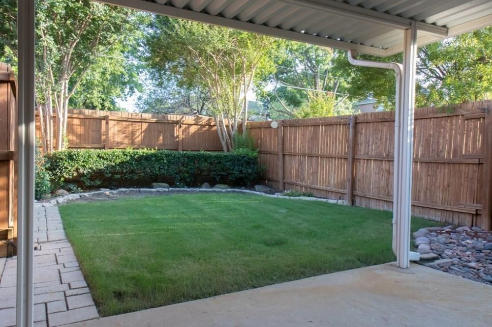 557 Grace Coppell, TX 75019 - Photo 6 of 22 a view of a backyard with a garden