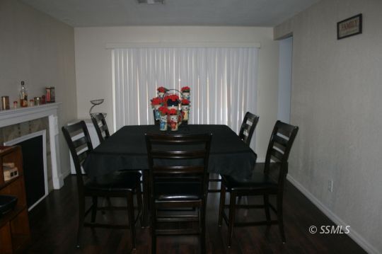 312 West Perdew Avenue Ridgecrest, CA 93555 - Photo 7 of 28 a view of a dining room with furniture and a potted plant