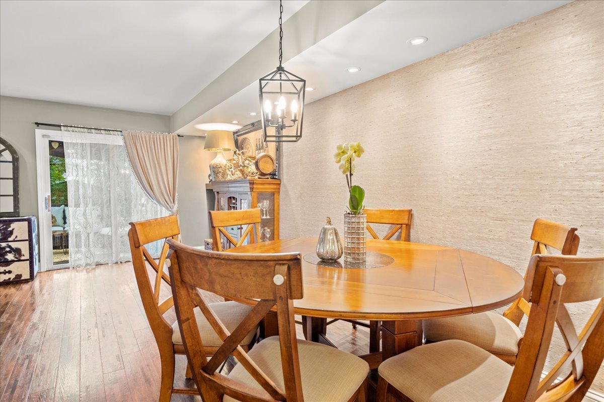 8025 Barrymore Drive Darien, IL 60561 - Photo 12 of 31 a dining room with furniture and chandelier