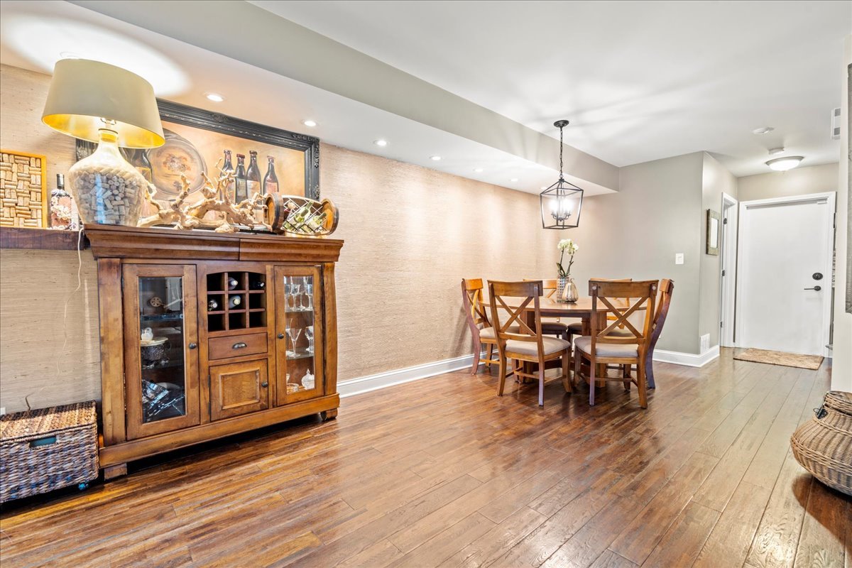 8025 Barrymore Drive Darien, IL 60561 - Photo 13 of 31 a view of a a dining room with furniture and wooden floor
