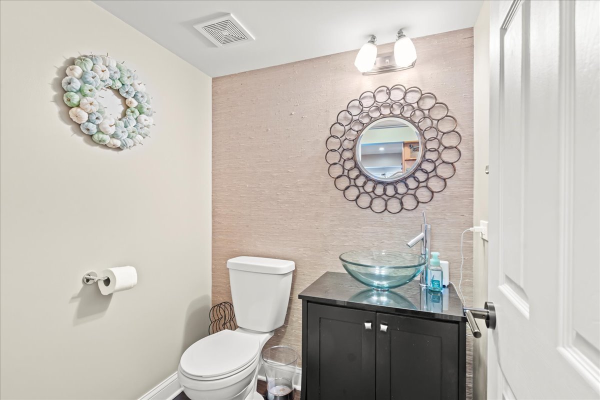 8025 Barrymore Drive Darien, IL 60561 - Photo 14 of 31 a bathroom with a toilet and a sink