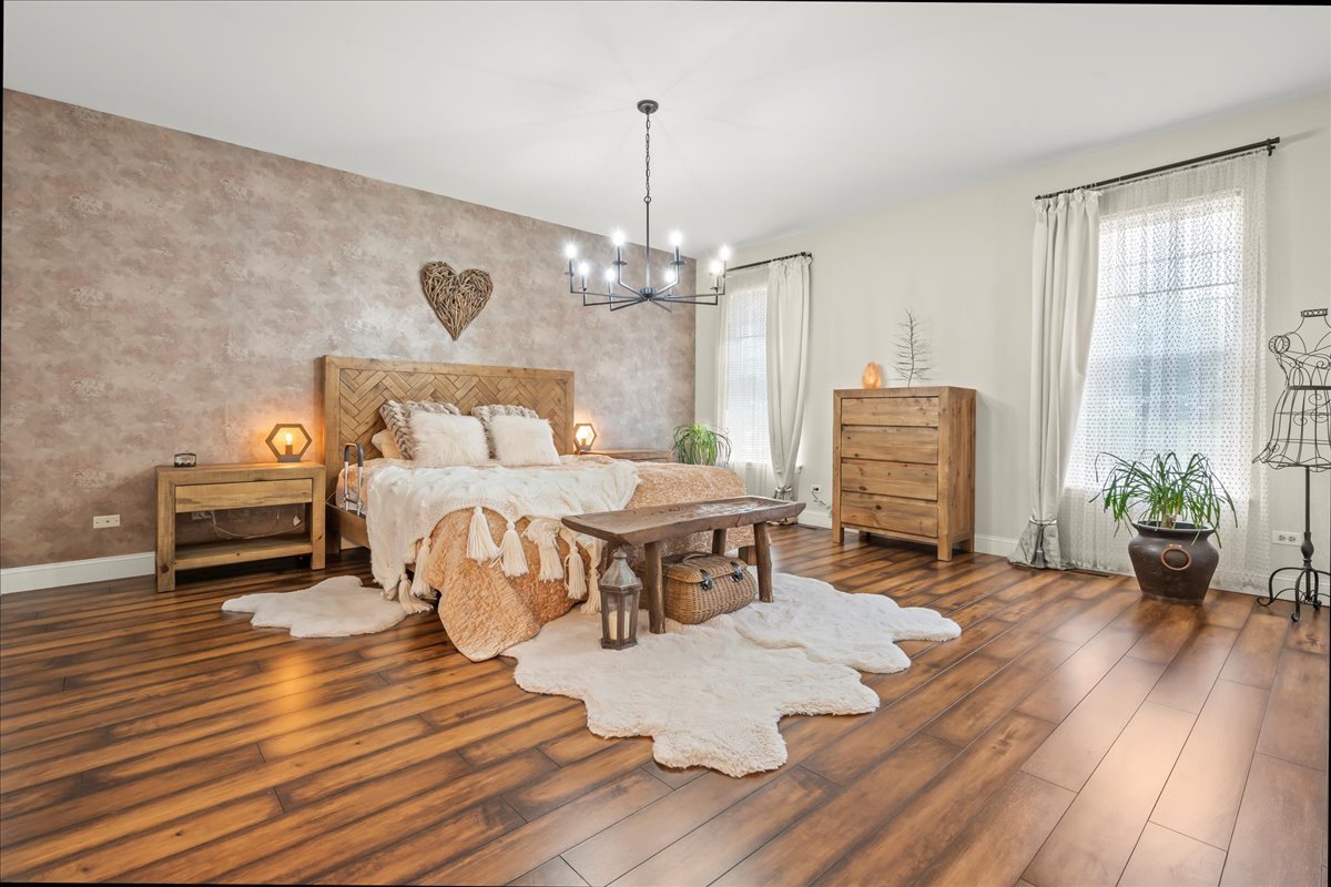 8025 Barrymore Drive Darien, IL 60561 - Photo 16 of 31 a living room with furniture and a wooden floor