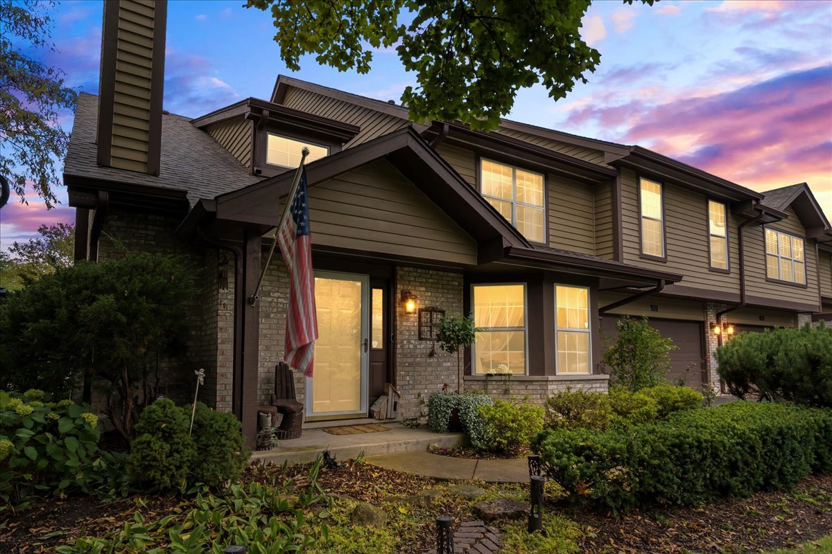 8025 Barrymore Drive Darien, IL 60561 - Photo 2 of 31 a front view of house with a garden