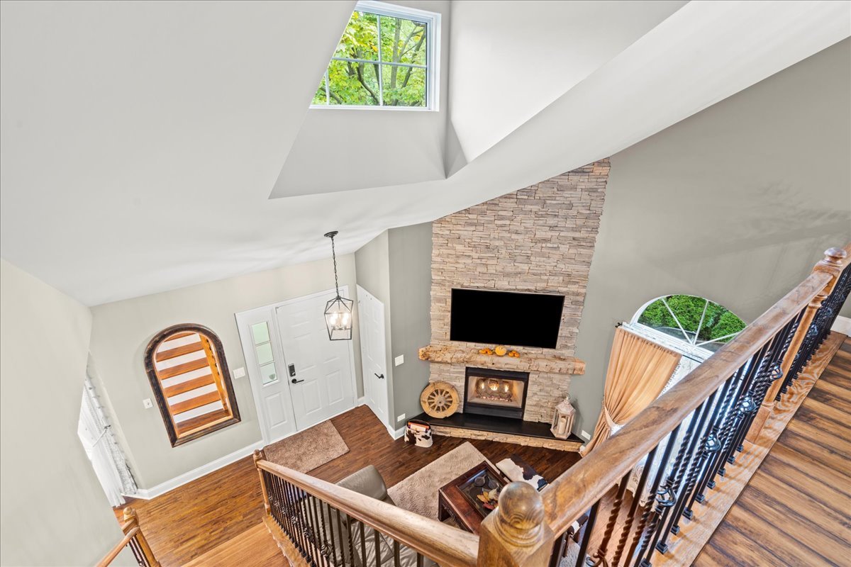 8025 Barrymore Drive Darien, IL 60561 - Photo 25 of 31 a living room with furniture and a fireplace