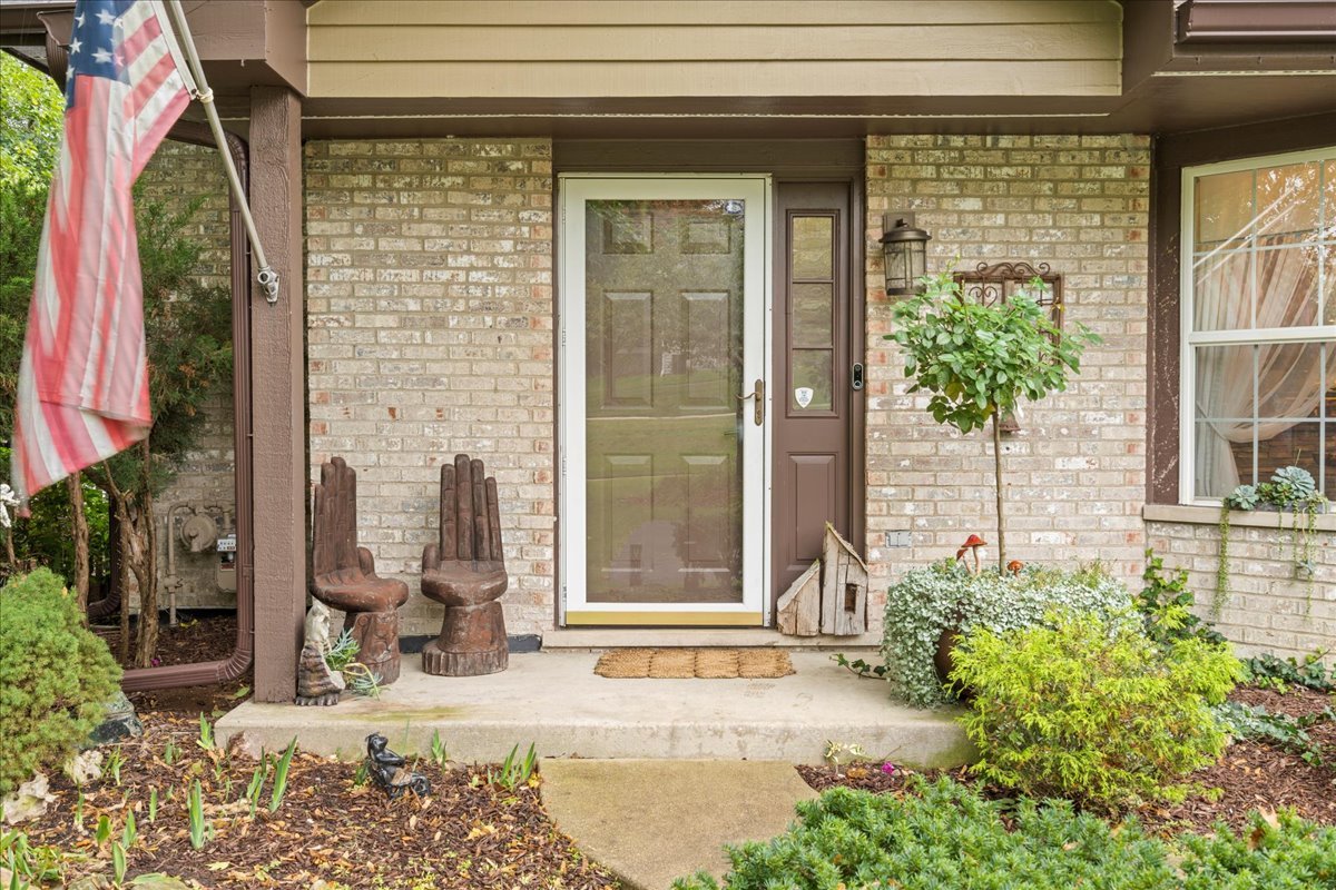 8025 Barrymore Drive Darien, IL 60561 - Photo 3 of 31 a front view of a house with a yard
