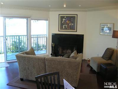 10 Ross Road Sausalito, CA 94965 - Photo 3 of 6 a living room with furniture and a flat screen tv