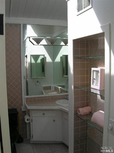 10 Ross Road Sausalito, CA 94965 - Photo 5 of 6 a bathroom with a sink mirror and toilet
