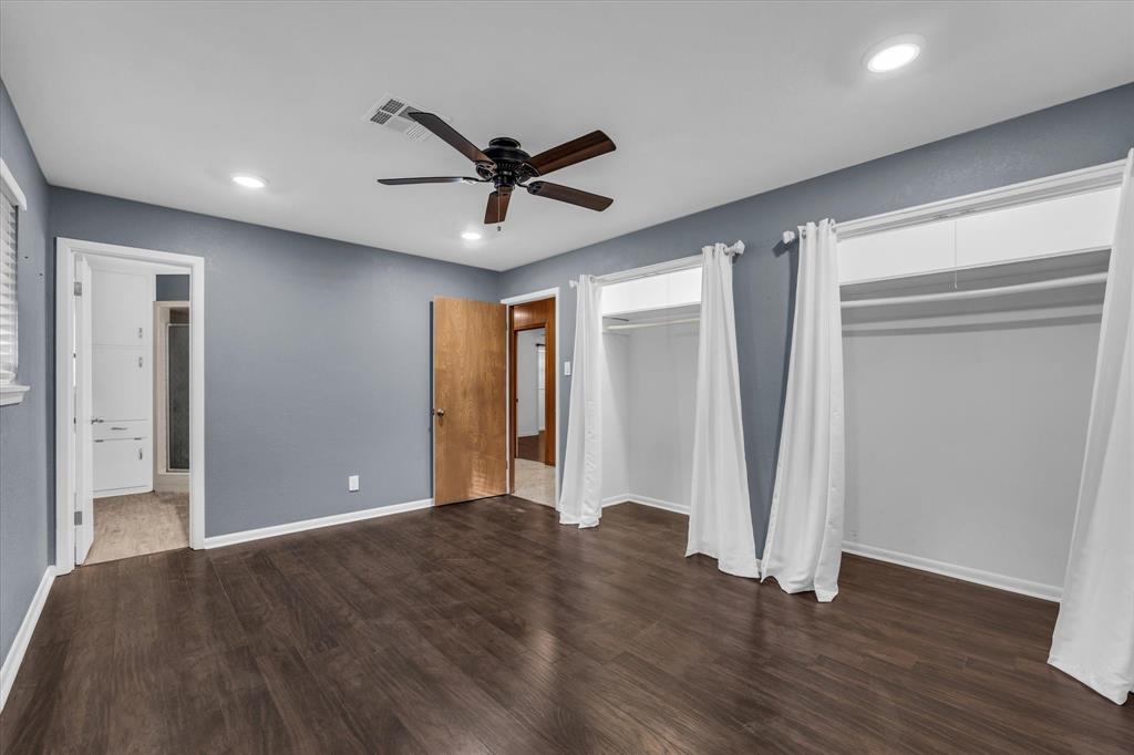 4325 Shady Glen Drive Waco, TX 76708 - Photo 26 of 40 a view of a big room with wooden floor and windows