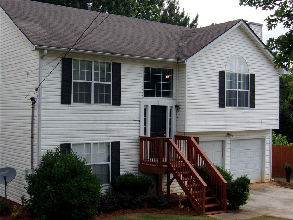 a front view of house with stairs