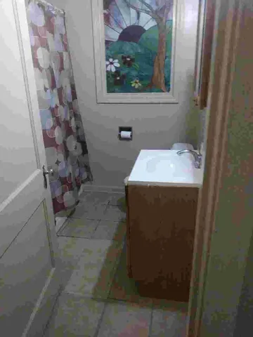 a bathroom with a sink and vanity