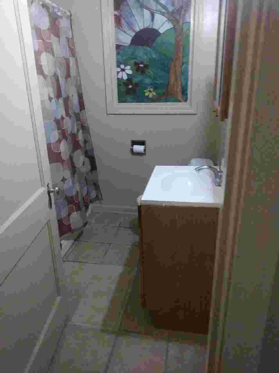 1505 Titus Road Memphis, TN 38111 - Photo 11 of 14 a bathroom with a sink and vanity