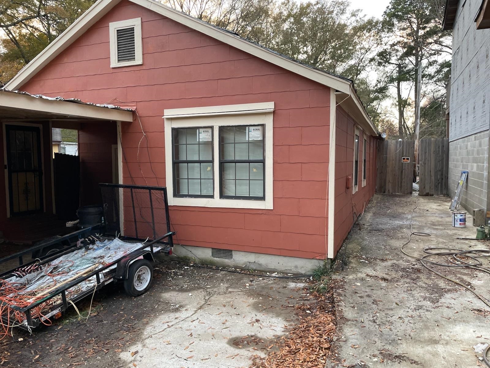 1505 Titus Road Memphis, TN 38111 - Photo 3 of 14 a view of backyard with a large tree