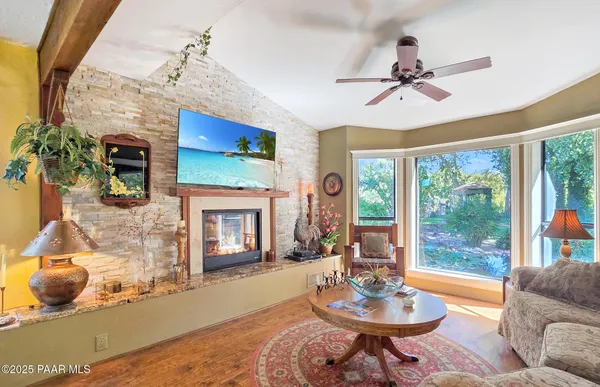 a large white kitchen with a stove a sink and dishwasher